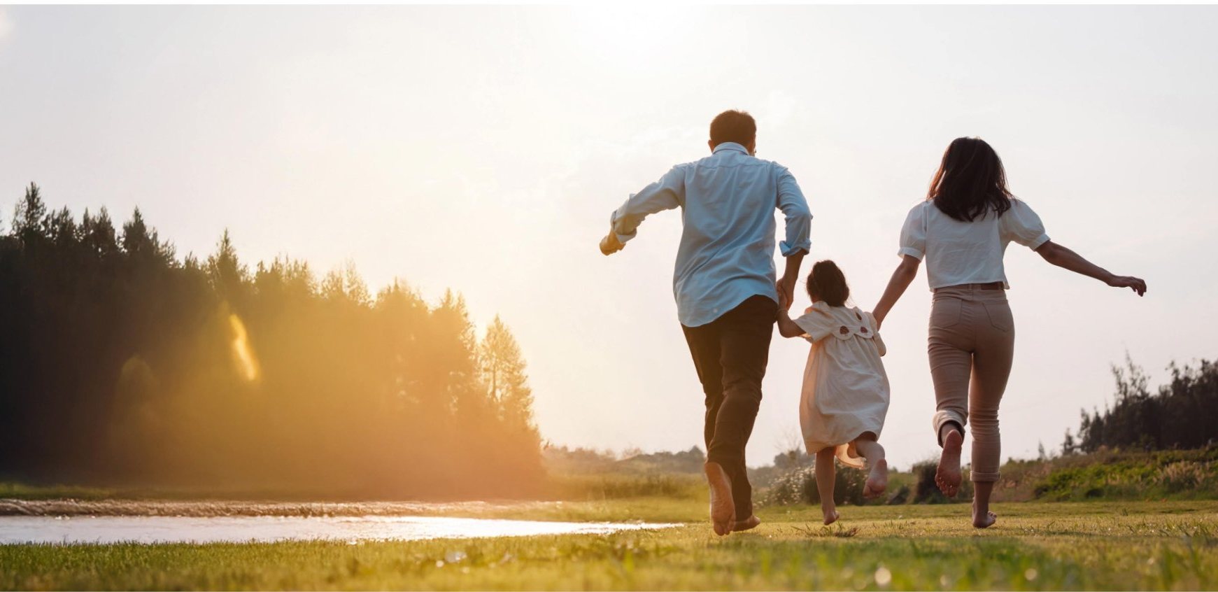 Family walking by the West Humber River near Arbor Grove townhomes in Brampton